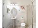 Clean bathroom with pedestal sink, shower, and toilet at 9024 Shadow Mountain St, Davenport, FL 33896
