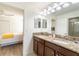 Modern bathroom with double vanity and granite countertop at 9024 Shadow Mountain St, Davenport, FL 33896