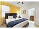 Bright bedroom with a king-size bed and ensuite bathroom at 9024 Shadow Mountain St, Davenport, FL 33896