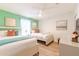 Spacious bedroom with two twin beds and teal accents at 9024 Shadow Mountain St, Davenport, FL 33896