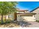 Two-story house with a three-car garage and a brick driveway at 9024 Shadow Mountain St, Davenport, FL 33896