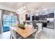 Modern kitchen with dark cabinetry, stainless steel appliances, and an island at 9024 Shadow Mountain St, Davenport, FL 33896