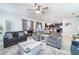 Open living room with a view of the kitchen and dining area at 9024 Shadow Mountain St, Davenport, FL 33896