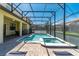 Enjoy this relaxing pool and spa with screened enclosure at 9024 Shadow Mountain St, Davenport, FL 33896
