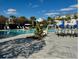 Resort-style community pool with umbrellas and lounge chairs for relaxing by the pool at 9416 Golden Laurel Ln, Orlando, FL 32827