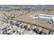 Aerial view of a community with houses, school, and park at 9459 Jaywood Rd, Winter Garden, FL 34787