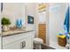 Modern bathroom with walk-in shower and granite vanity at 9459 Jaywood Rd, Winter Garden, FL 34787