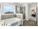 Spa-like bathroom featuring a soaking tub, walk-in shower, and modern fixtures at 9459 Jaywood Rd, Winter Garden, FL 34787