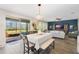Open kitchen with white cabinets, island, and access to backyard at 9459 Jaywood Rd, Winter Garden, FL 34787