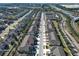 An aerial view of a townhouse community showing the layout, streets, and proximity to highways at 1044 Pavia Dr, Apopka, FL 32703