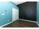 Bedroom featuring bright blue walls, dark accent wall and a spacious closet, offering a stylish, comfortable space at 1044 Pavia Dr, Apopka, FL 32703