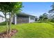 Screened patio and grassy backyard with mature trees at 1069 Avery Meadows Way, Deland, FL 32724