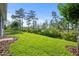 Landscaped backyard offering a serene preserve view at 1069 Avery Meadows Way, Deland, FL 32724