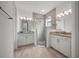 Double vanity bathroom with a large walk-in shower at 1069 Avery Meadows Way, Deland, FL 32724