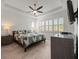 Spacious bedroom with a king-size bed and large windows at 1069 Avery Meadows Way, Deland, FL 32724