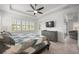 Main bedroom with king bed, wood floors, and access to patio at 1069 Avery Meadows Way, Deland, FL 32724