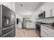 Modern kitchen with stainless steel appliances and granite countertops at 1069 Avery Meadows Way, Deland, FL 32724