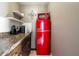 Charming kitchenette featuring a vintage red refrigerator, perfect for a cozy space at 11148 Einbender Rd, Orlando, FL 32825