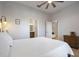 Comfortable bedroom with a queen bed and ensuite bathroom access at 11626 Graces Way, Clermont, FL 34711