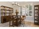 Bright dining area with built-in shelving and wood flooring at 11626 Graces Way, Clermont, FL 34711