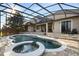 Resort-style pool and spa with expansive patio at 11626 Graces Way, Clermont, FL 34711