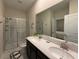 Modern bathroom with double vanity and large walk-in shower at 1178 Drop Ln, Kissimmee, FL 34747