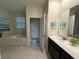 Elegant bathroom with soaking tub, double vanity, and walk-in shower at 1178 Drop Ln, Kissimmee, FL 34747