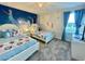 Frozen themed bedroom with two twin beds and Frozen mural at 1178 Drop Ln, Kissimmee, FL 34747