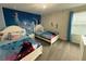 Charming Frozen-themed bedroom with twin beds and Frozen wall art at 1178 Drop Ln, Kissimmee, FL 34747