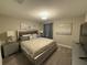 Spacious Primary bedroom with large bed and TV at 1178 Drop Ln, Kissimmee, FL 34747