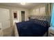 Primary bedroom with large bed and ensuite bathroom at 1178 Drop Ln, Kissimmee, FL 34747