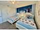 Frozen themed bedroom with two twin beds and Frozen mural at 1178 Drop Ln, Kissimmee, FL 34747