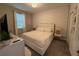 Spacious bedroom with king-size bed and decorative wall accents at 1178 Drop Ln, Kissimmee, FL 34747