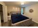 Spacious bedroom with a king-size bed and en-suite bathroom at 1178 Drop Ln, Kissimmee, FL 34747