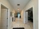 Bright hallway with tile floors, leading to living areas and bedrooms at 1178 Drop Ln, Kissimmee, FL 34747