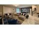 Open living area with sectional sofa, dining area, and access to backyard at 1178 Drop Ln, Kissimmee, FL 34747