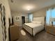 Large main bedroom with king-size bed and ensuite bathroom at 1178 Drop Ln, Kissimmee, FL 34747
