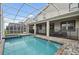 Relaxing pool and spa with covered patio at 1178 Drop Ln, Kissimmee, FL 34747
