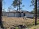 New construction home with a two-car garage and neutral color palette at 1190 East Pkwy, Deland, FL 32724