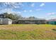Large backyard with shed, playset, and trampoline at 1201 Carol Ave, Auburndale, FL 33823