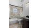 Clean bathroom with shower/tub combo and dark vanity at 1201 Carol Ave, Auburndale, FL 33823