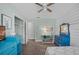 Light and airy bedroom featuring a full-size bed and teal dresser at 1201 Carol Ave, Auburndale, FL 33823