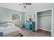 Bedroom with full bed, teal dresser, and closet at 1201 Carol Ave, Auburndale, FL 33823