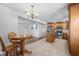Kitchen with adjacent dining area and wood floors at 1201 Carol Ave, Auburndale, FL 33823
