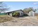 House exterior with driveway and storage shed at 1201 Carol Ave, Auburndale, FL 33823