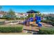 Vibrant neighborhood playground with slide and climbing features at 13870 Jomatt Loop, Winter Garden, FL 34787