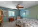 Cozy bedroom with a ceiling fan and large window at 151 E Plantation Blvd, Lake Mary, FL 32746