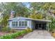 Cute light blue manufactured home with covered carport and mature landscaping at 151 E Plantation Blvd, Lake Mary, FL 32746