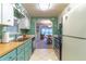 Galley kitchen with wood countertops and stainless steel appliances at 151 E Plantation Blvd, Lake Mary, FL 32746