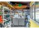 Laundry room with washer, dryer, and storage shelving at 151 E Plantation Blvd, Lake Mary, FL 32746